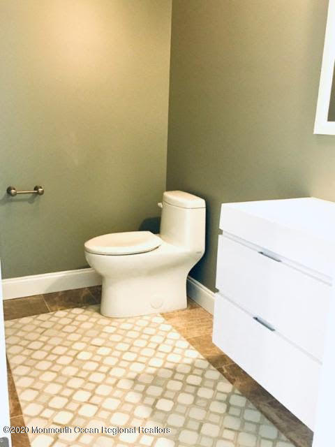 409 Jackson Mills Road Freehold, NJ 07728 - Photo 19 of 35 a bathroom with a sink and a toilet