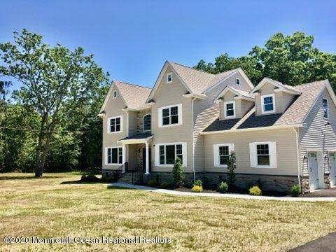 409 Jackson Mills Road Freehold, NJ 07728 - Photo 2 of 35 a front view of a house with a yard