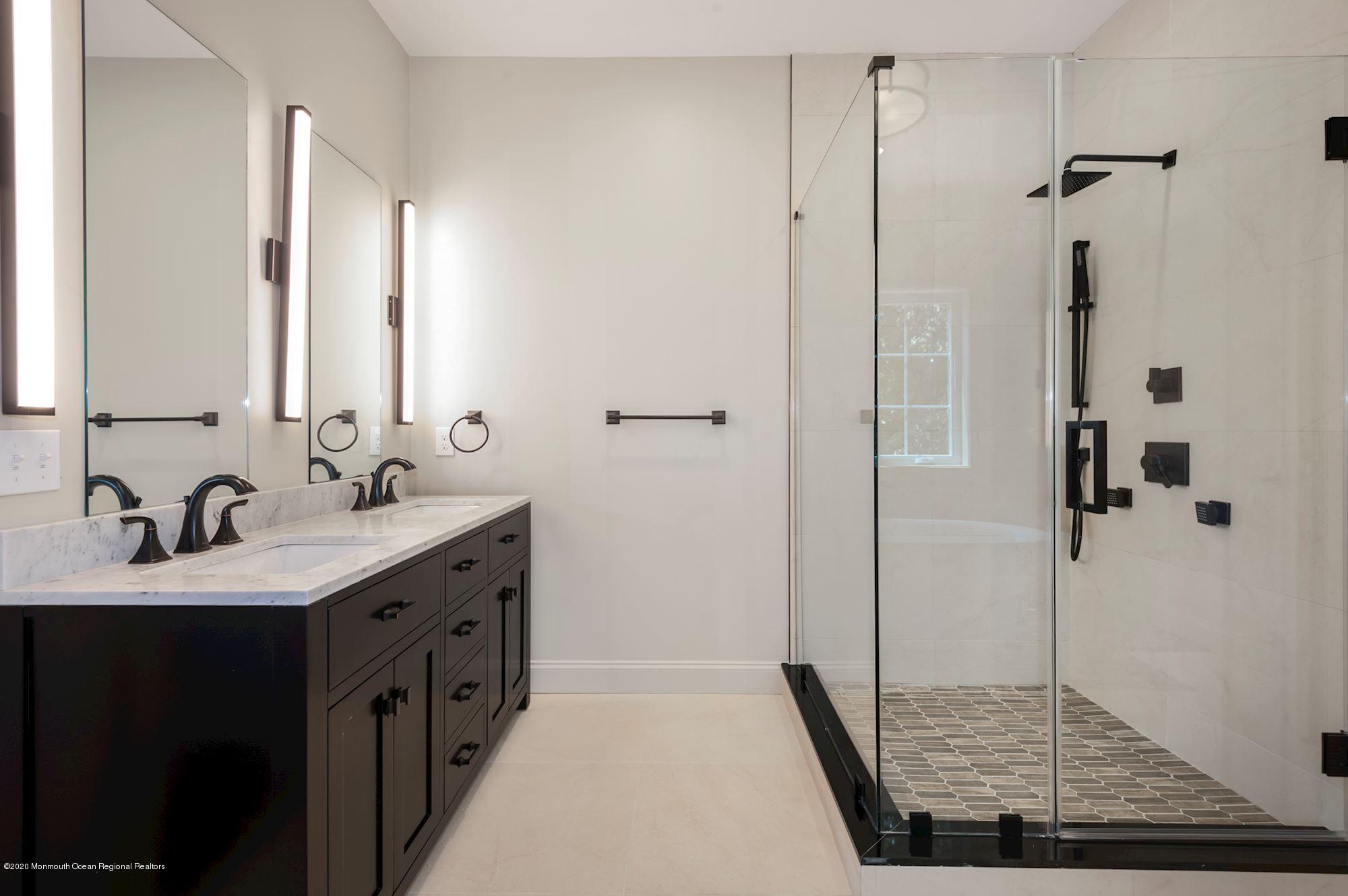 409 Jackson Mills Road Freehold, NJ 07728 - Photo 25 of 35 a bathroom with a sink and mirror