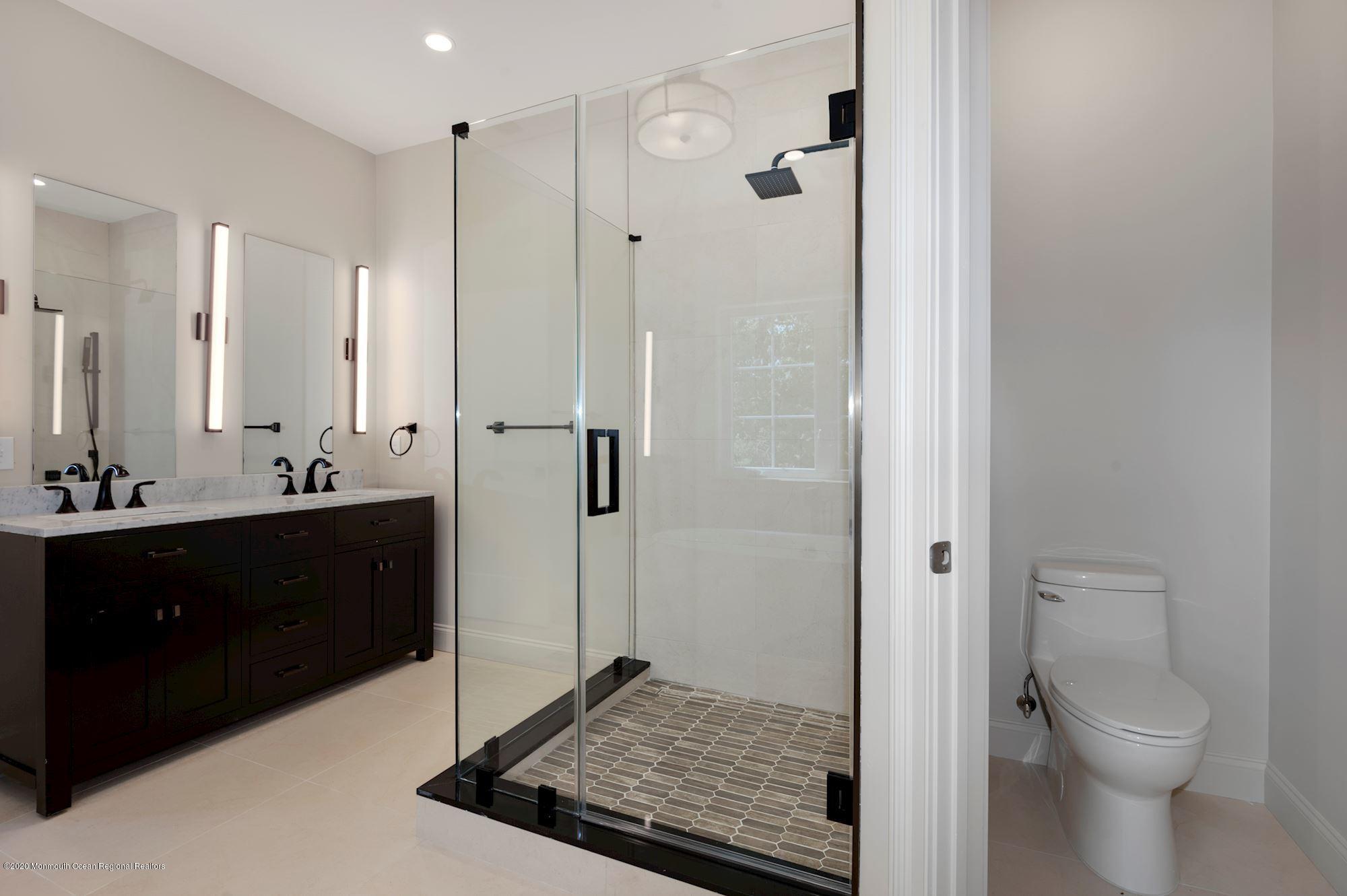 409 Jackson Mills Road Freehold, NJ 07728 - Photo 26 of 35 a bathroom with a sink and a mirror
