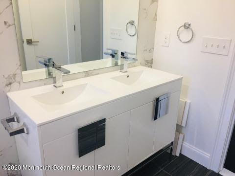 409 Jackson Mills Road Freehold, NJ 07728 - Photo 30 of 35 a bathroom with a sink vanity and a mirror