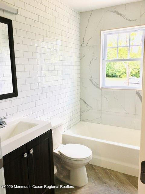 409 Jackson Mills Road Freehold, NJ 07728 - Photo 31 of 35 a bathroom with a sink toilet and shower
