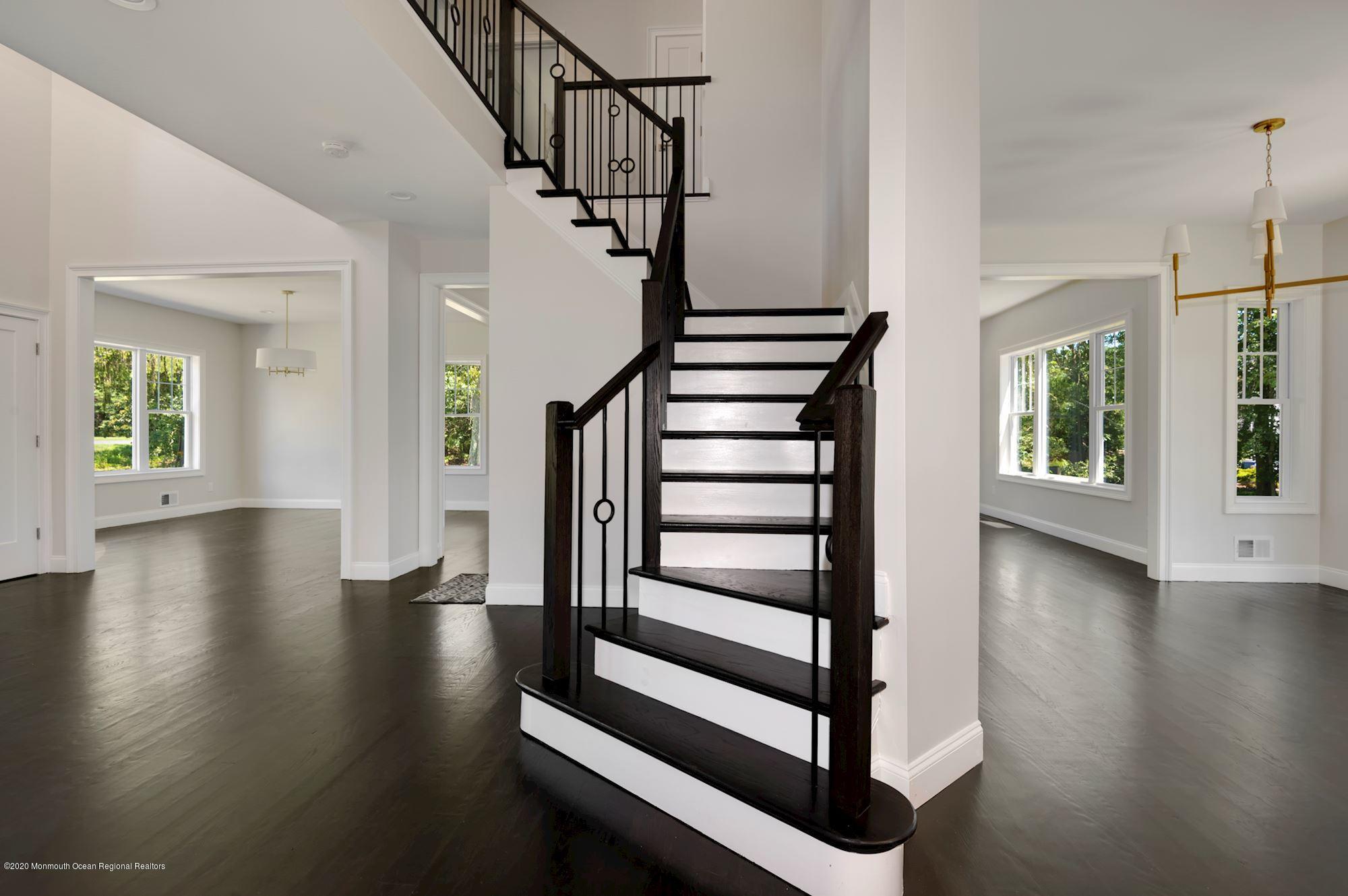 409 Jackson Mills Road Freehold, NJ 07728 - Photo 8 of 35 a view of entryway with wooden floor and front door