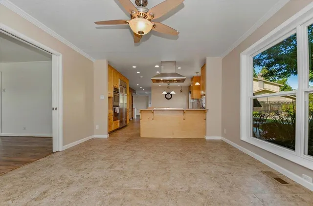 a kitchen with stainless steel appliances granite countertop a stove a sink and a refrigerator