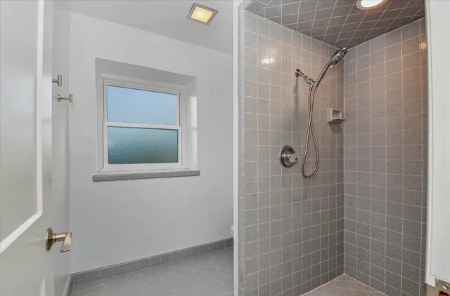 a view of a swimming pool with a lounge chair