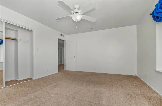 a view of a house with a yard and garden