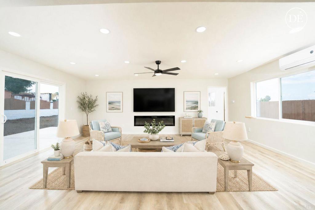 1314 Bluegrass Road Vista, CA 92083 - Photo 7 of 16 a living room with furniture and a flat screen tv