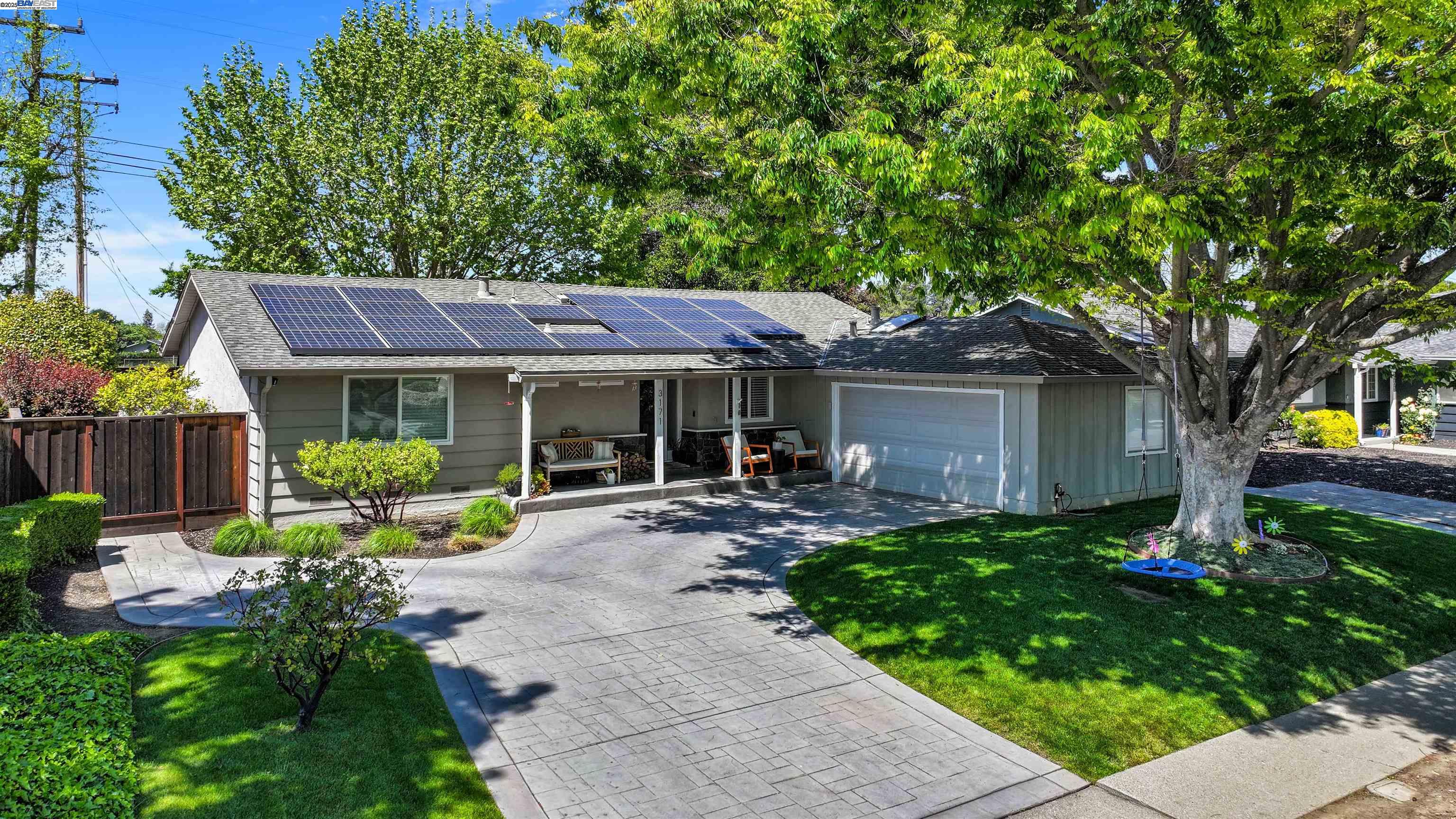 a front view of a house with garden and porch