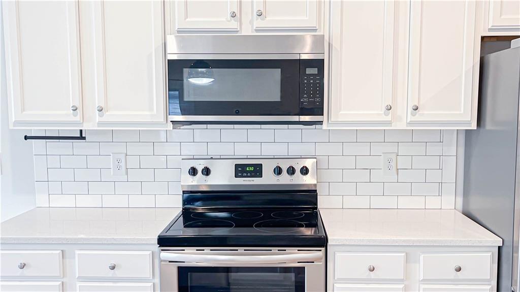 740 Eudora Welty Way Athens, GA 30607 - Photo 15 of 57 a stove top oven sitting inside of a kitchen