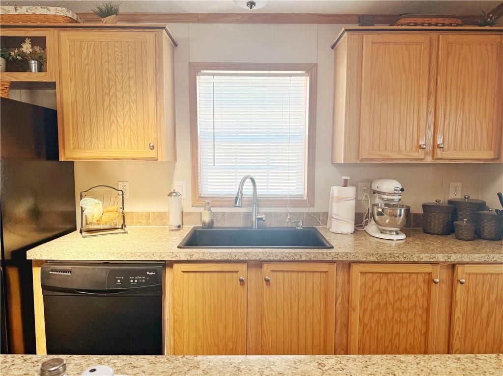 137 York Road Cranberry Township, PA 16066 - Photo 13 of 44 a kitchen with stainless steel appliances granite countertop a sink dishwasher and cabinets with wooden floor