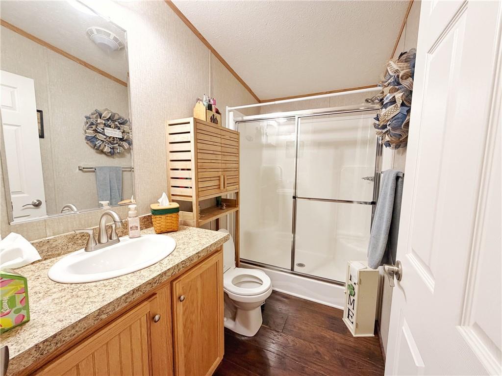 137 York Road Cranberry Township, PA 16066 - Photo 26 of 44 a bathroom with a granite countertop sink toilet a mirror a vanity and shower
