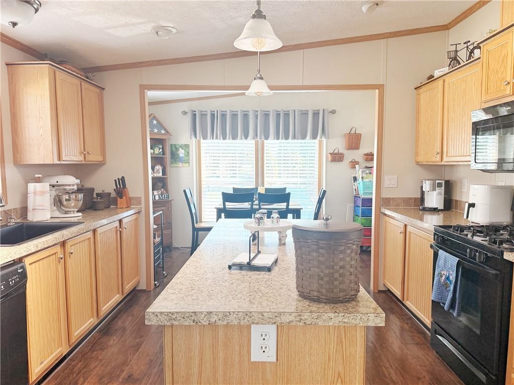 137 York Road Cranberry Township, PA 16066 - Photo 8 of 44 a kitchen with granite countertop a stove and a wooden floors