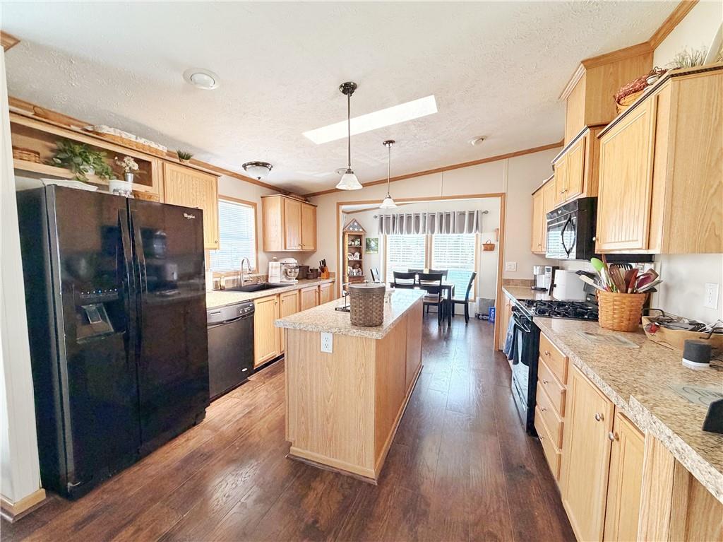 137 York Road Cranberry Township, PA 16066 - Photo 9 of 44 a kitchen with counter top space a sink appliances and wooden floor