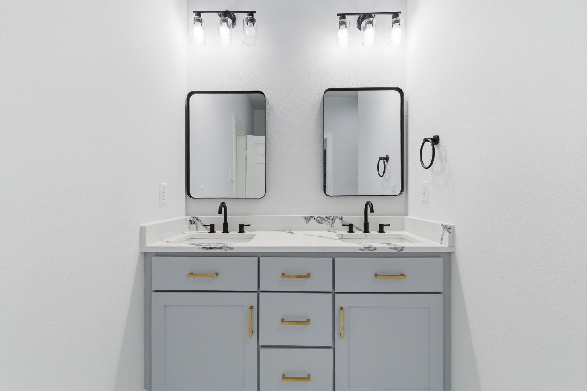 7040 Kinney Street Houston, TX 77087 - Photo 11 of 47 a bathroom with a double vanity sink and mirror