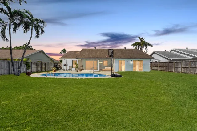 a front view of house with yard and seating area