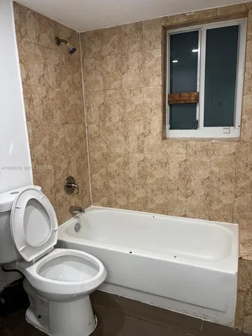 a bathroom with a sink a toilet and a bathtub