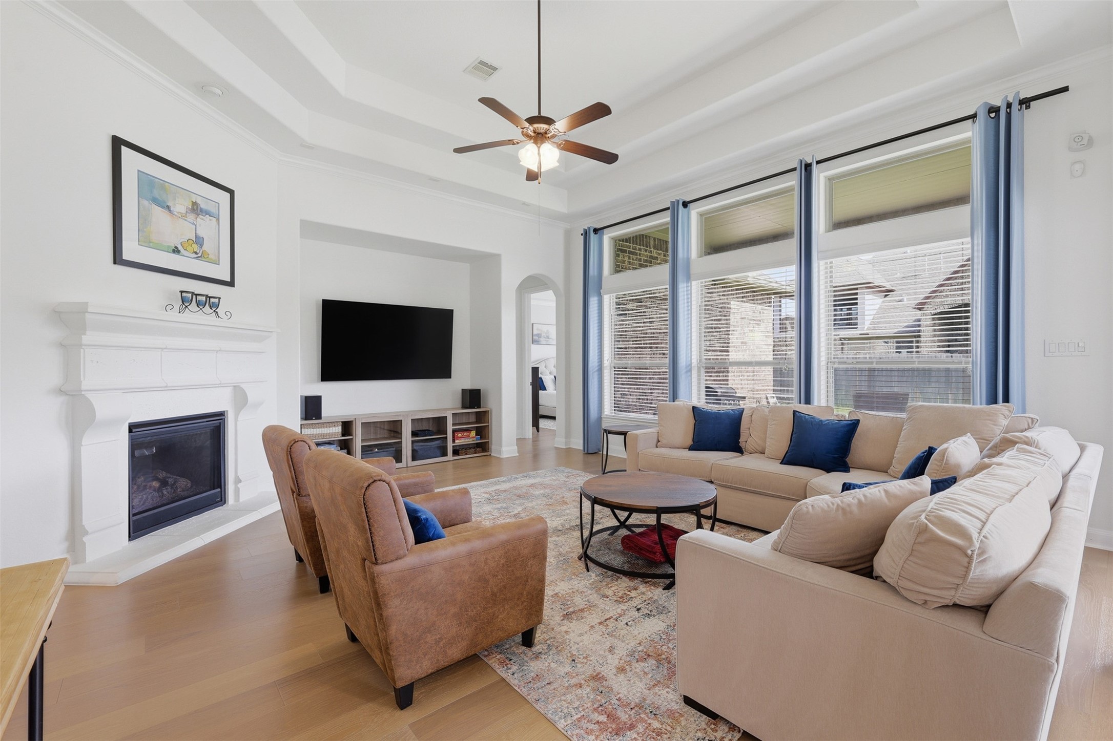 6835 Preston Grove Drive Spring, TX 77389 - Photo 21 of 49 a living room with furniture a flat screen tv and a fireplace