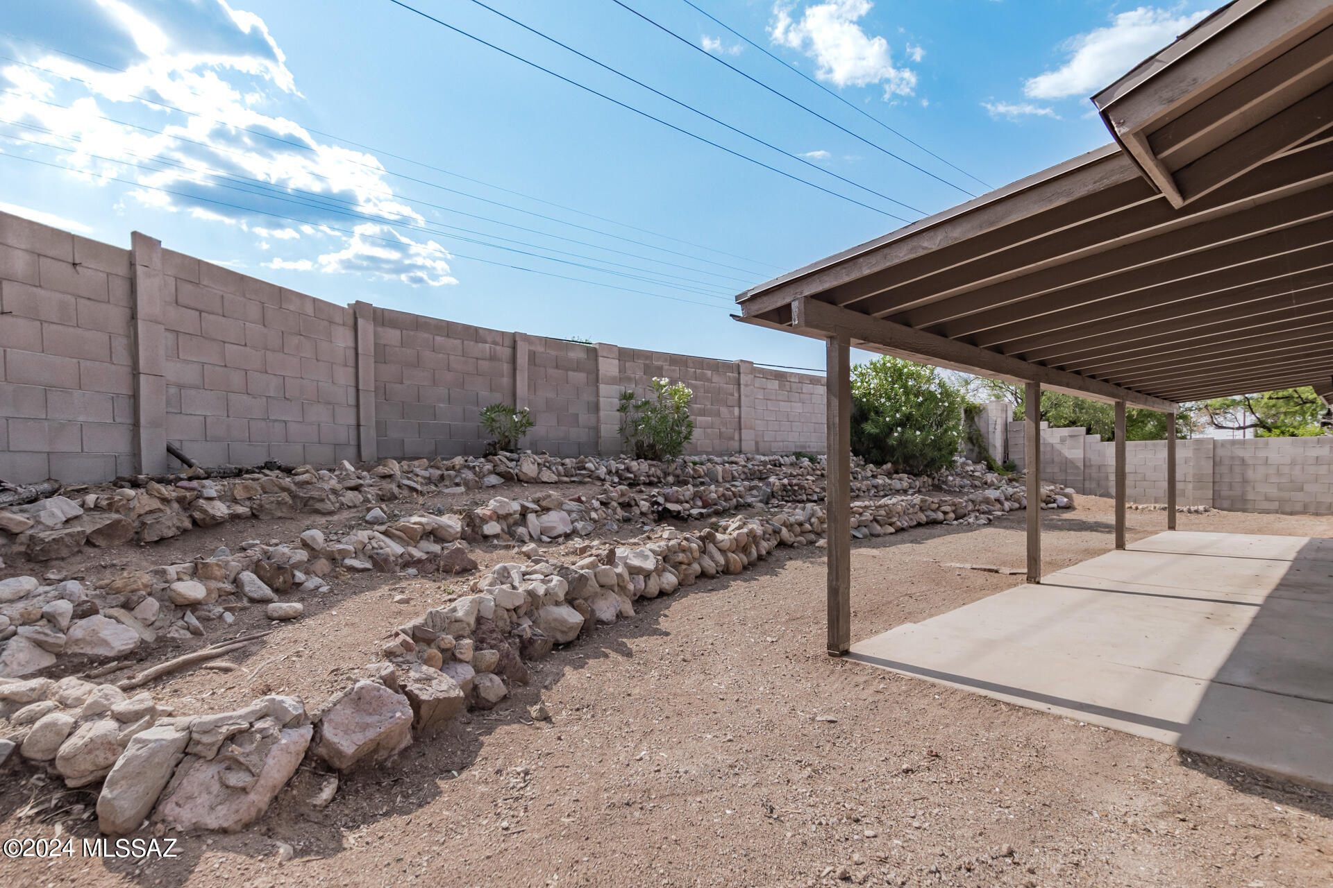 1454 South Gecko Road Tucson, AZ 85713 - Photo 23 of 24 a view of a backyard with sitting area