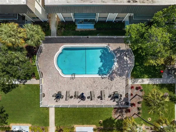 an aerial view of a house with garden space sitting space and swimming pool