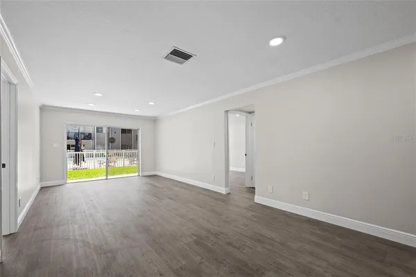 a view of an empty room with a window
