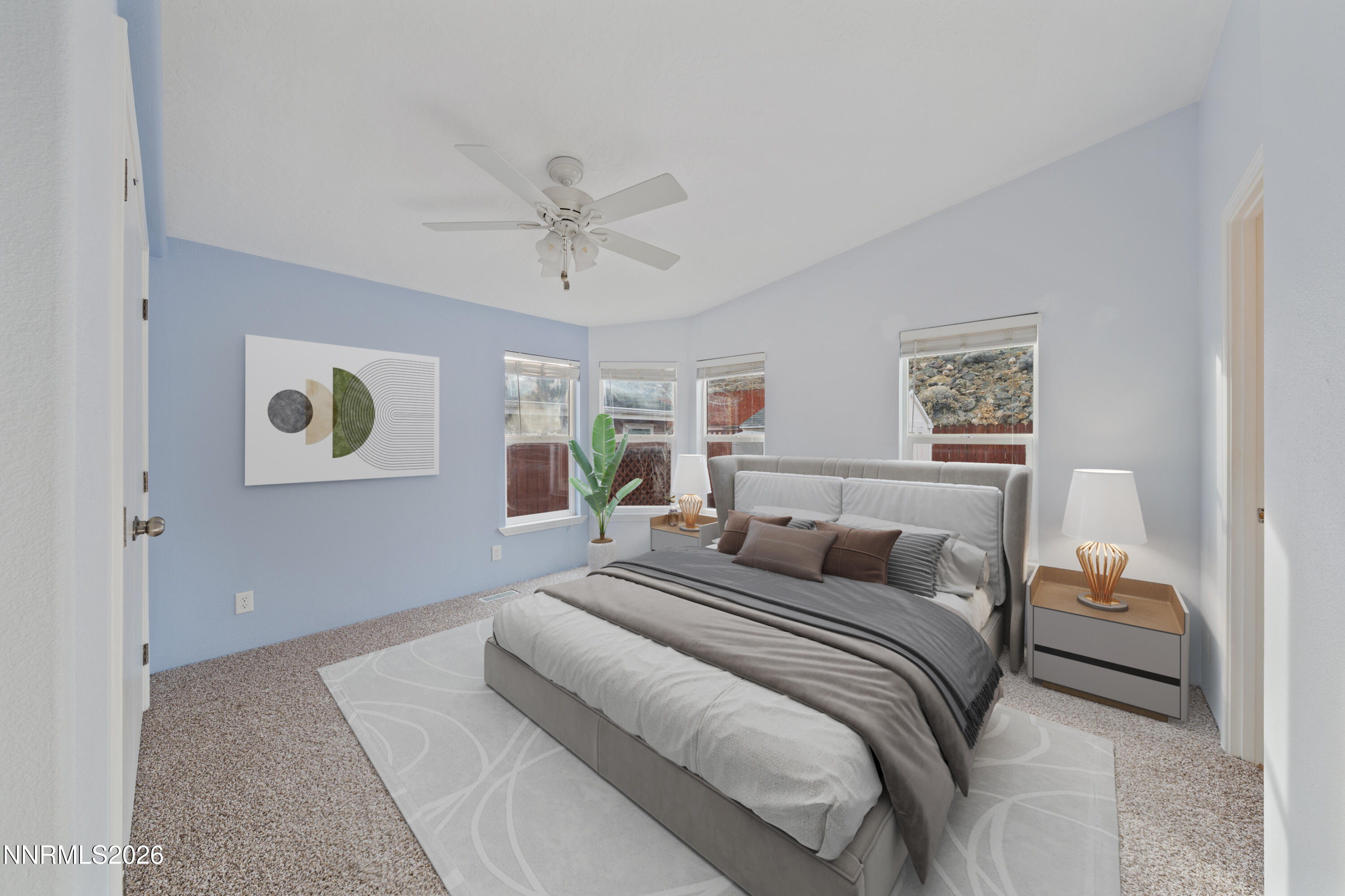 5277 Mt Dana Drive Reno, NV 89506 - Photo 11 of 49 a bedroom with a large bed and a chandelier