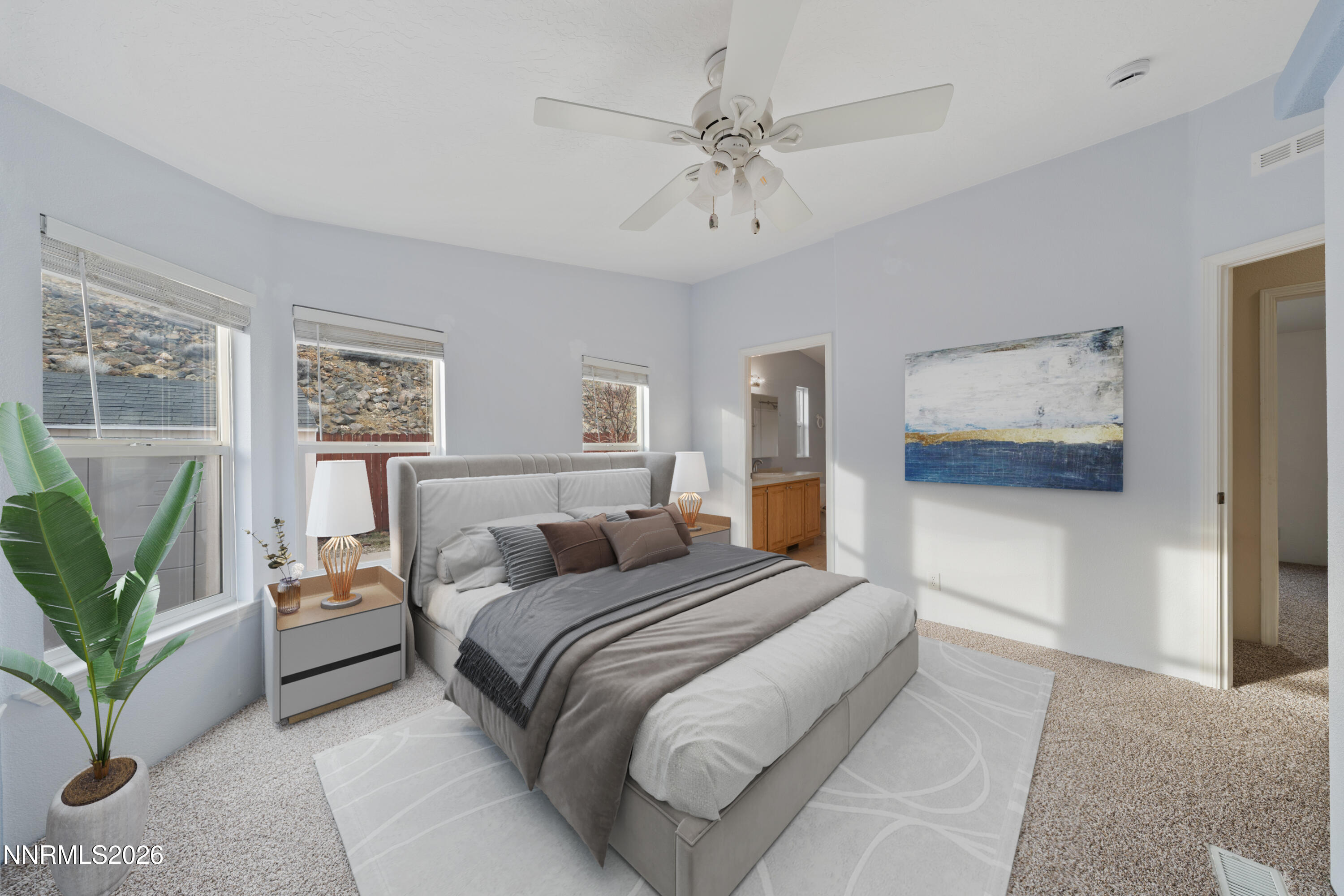 5277 Mt Dana Drive Reno, NV 89506 - Photo 13 of 49 a bedroom with a large bed and a chandelier