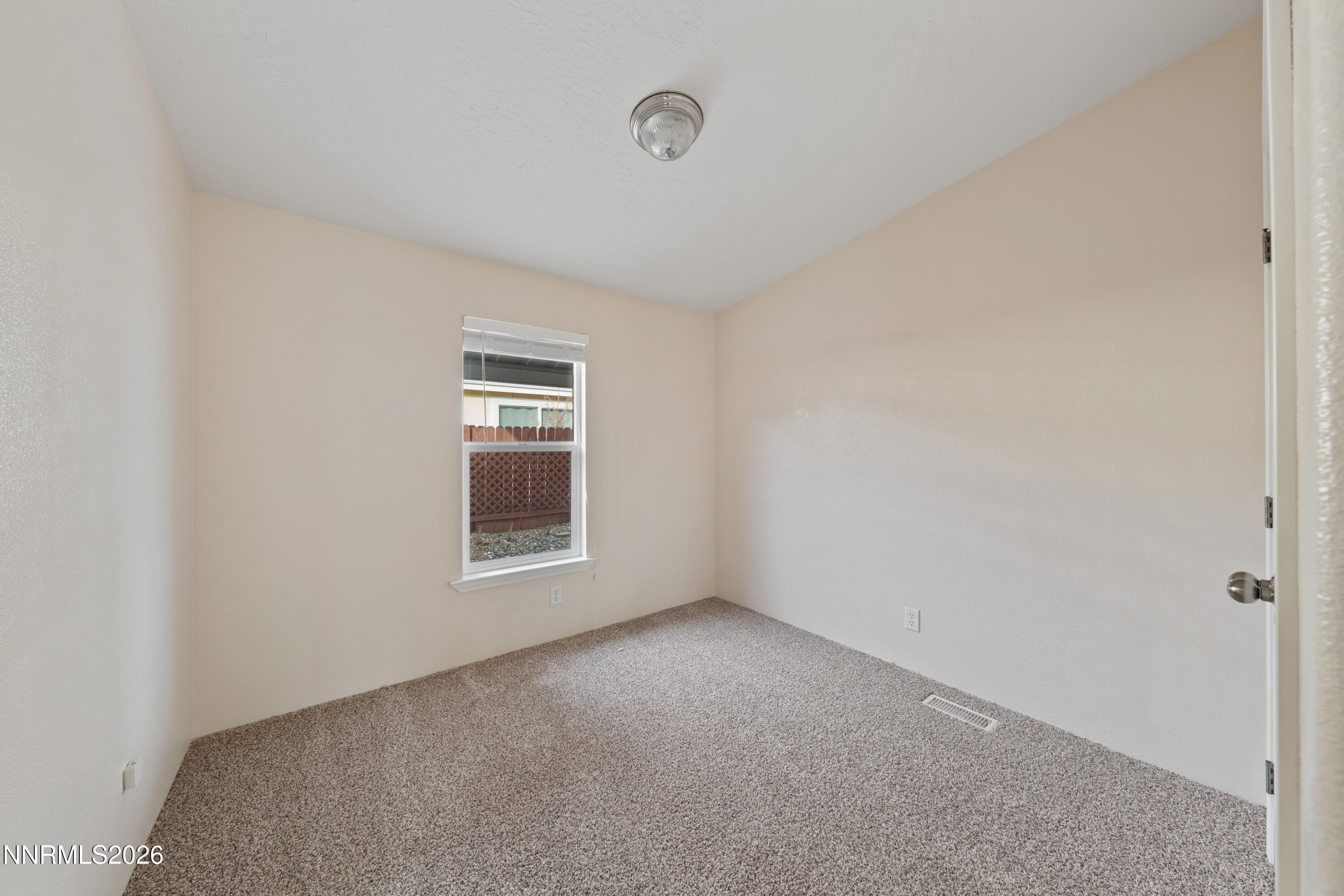 5277 Mt Dana Drive Reno, NV 89506 - Photo 20 of 49 a view of an empty room with a window
