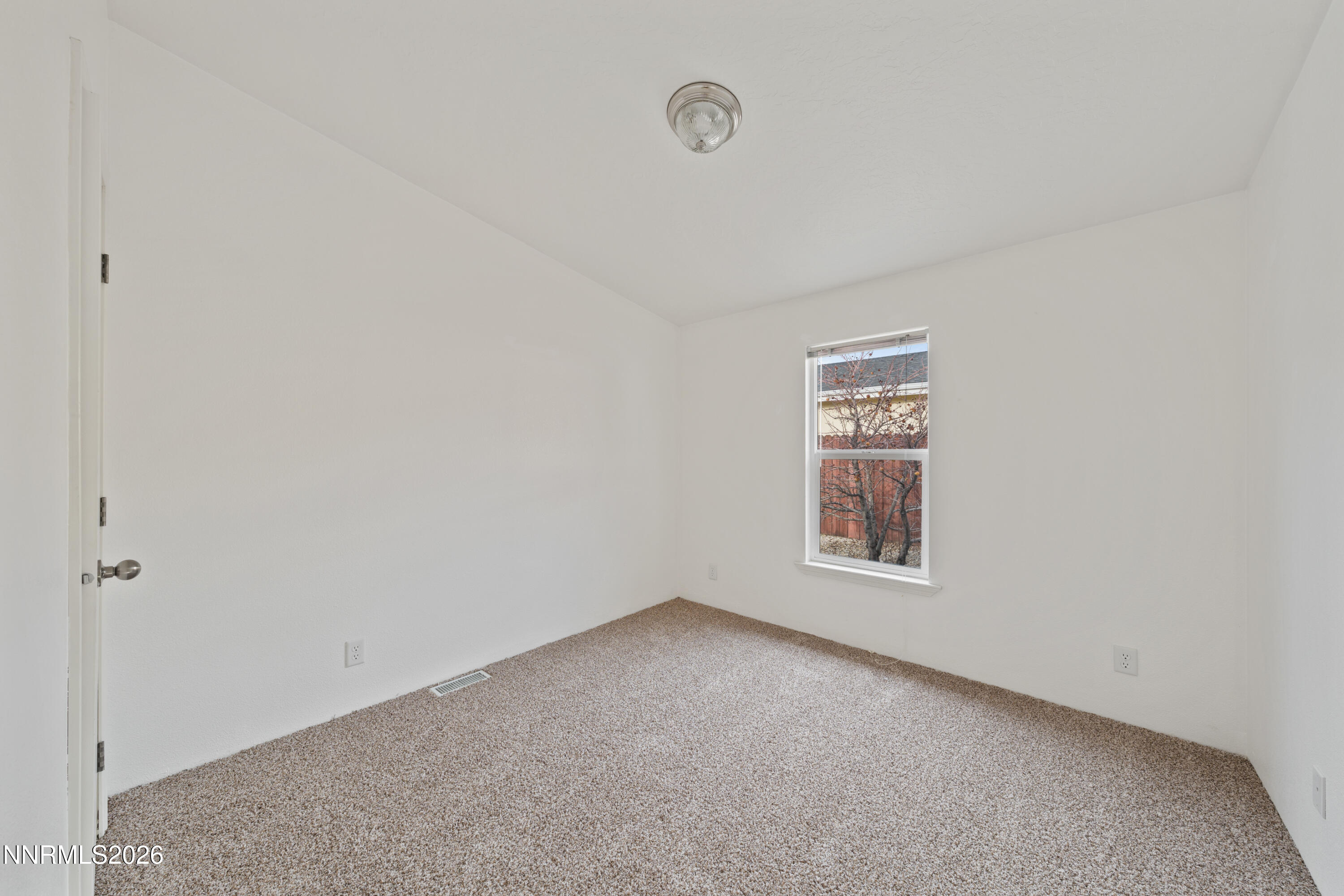5277 Mt Dana Drive Reno, NV 89506 - Photo 23 of 49 a view of an empty room with a window