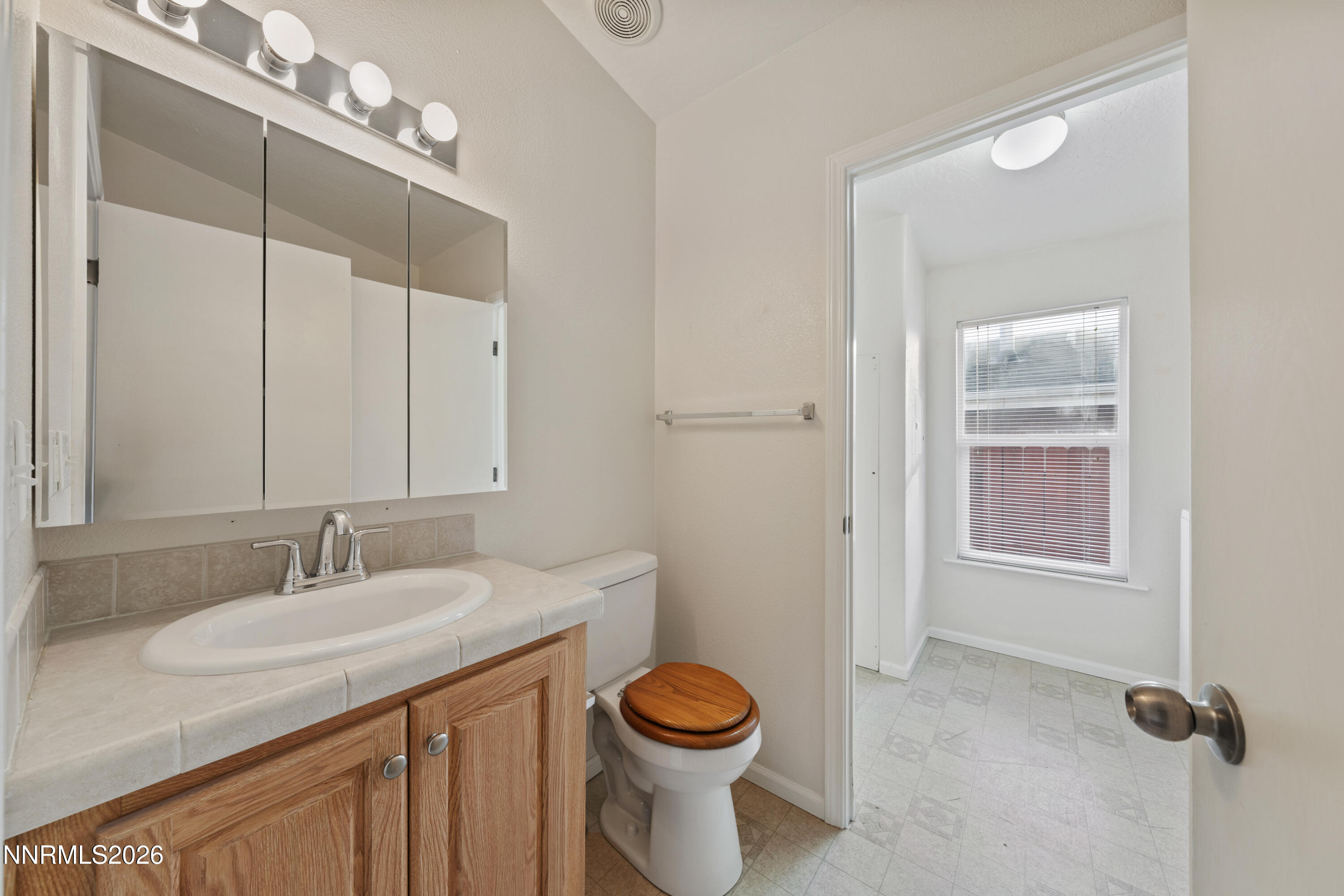 5277 Mt Dana Drive Reno, NV 89506 - Photo 27 of 49 a bathroom with a sink a toilet and shower