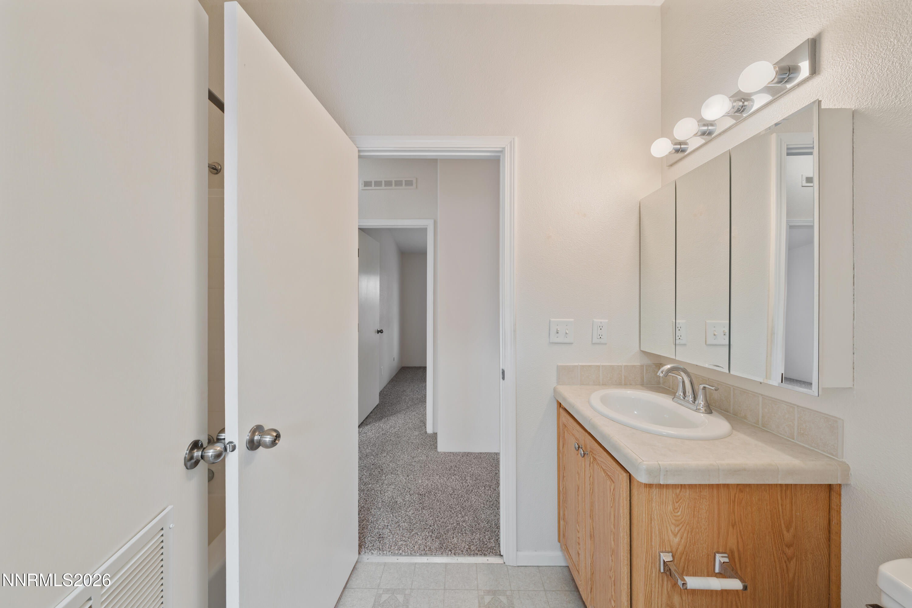 5277 Mt Dana Drive Reno, NV 89506 - Photo 29 of 49 a bathroom with a sink and a mirror