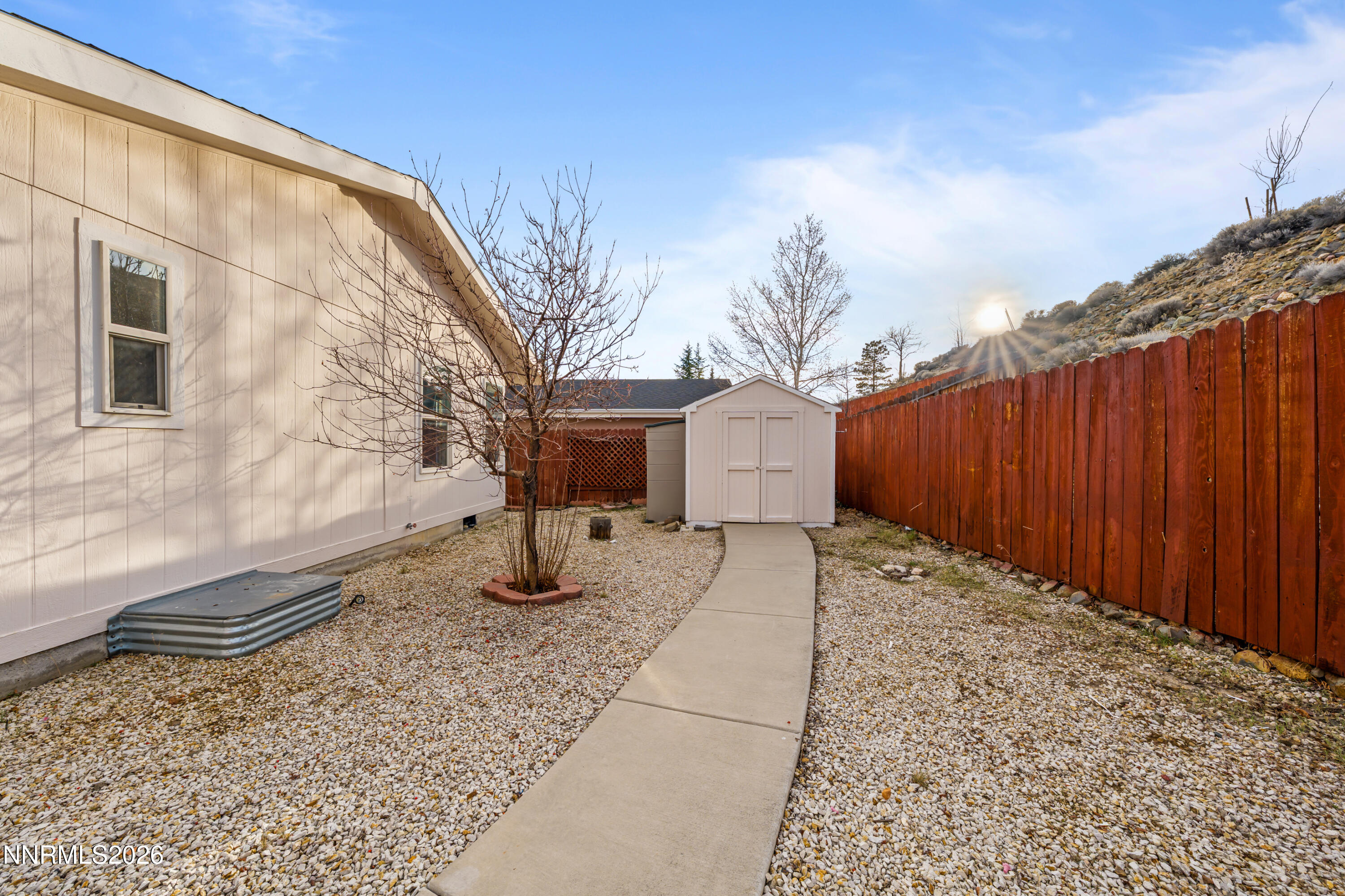 5277 Mt Dana Drive Reno, NV 89506 - Photo 33 of 49 a view of a house with backyard and trees