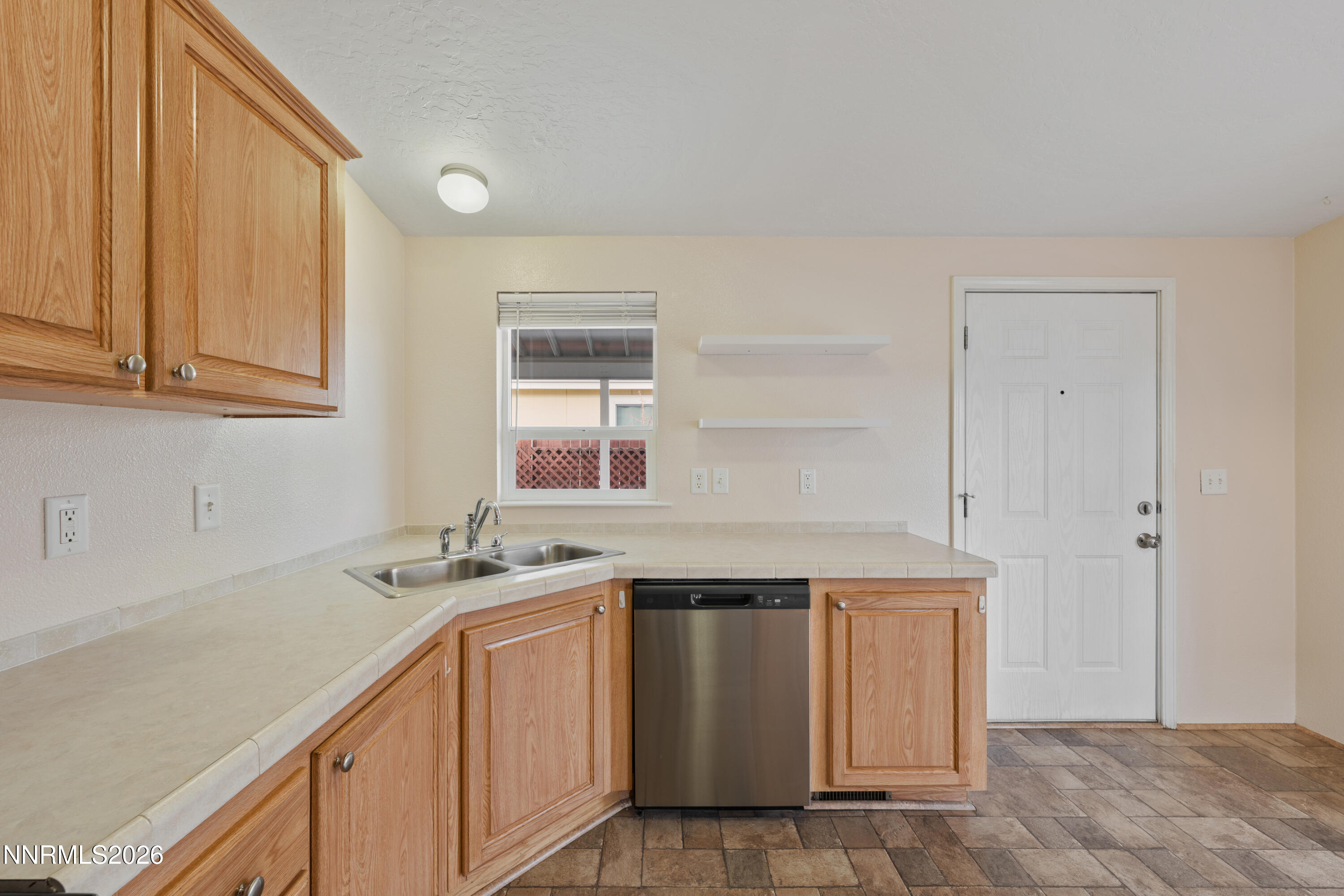 5277 Mt Dana Drive Reno, NV 89506 - Photo 8 of 49 a utility room with cabinets washer and dryer
