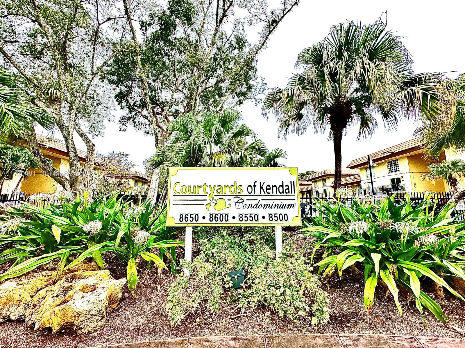 8550 Southwest 109th Avenue, Unit 5217 Miami, FL 33173 - Photo 16 of 16 a sign that is sitting in front of a tree