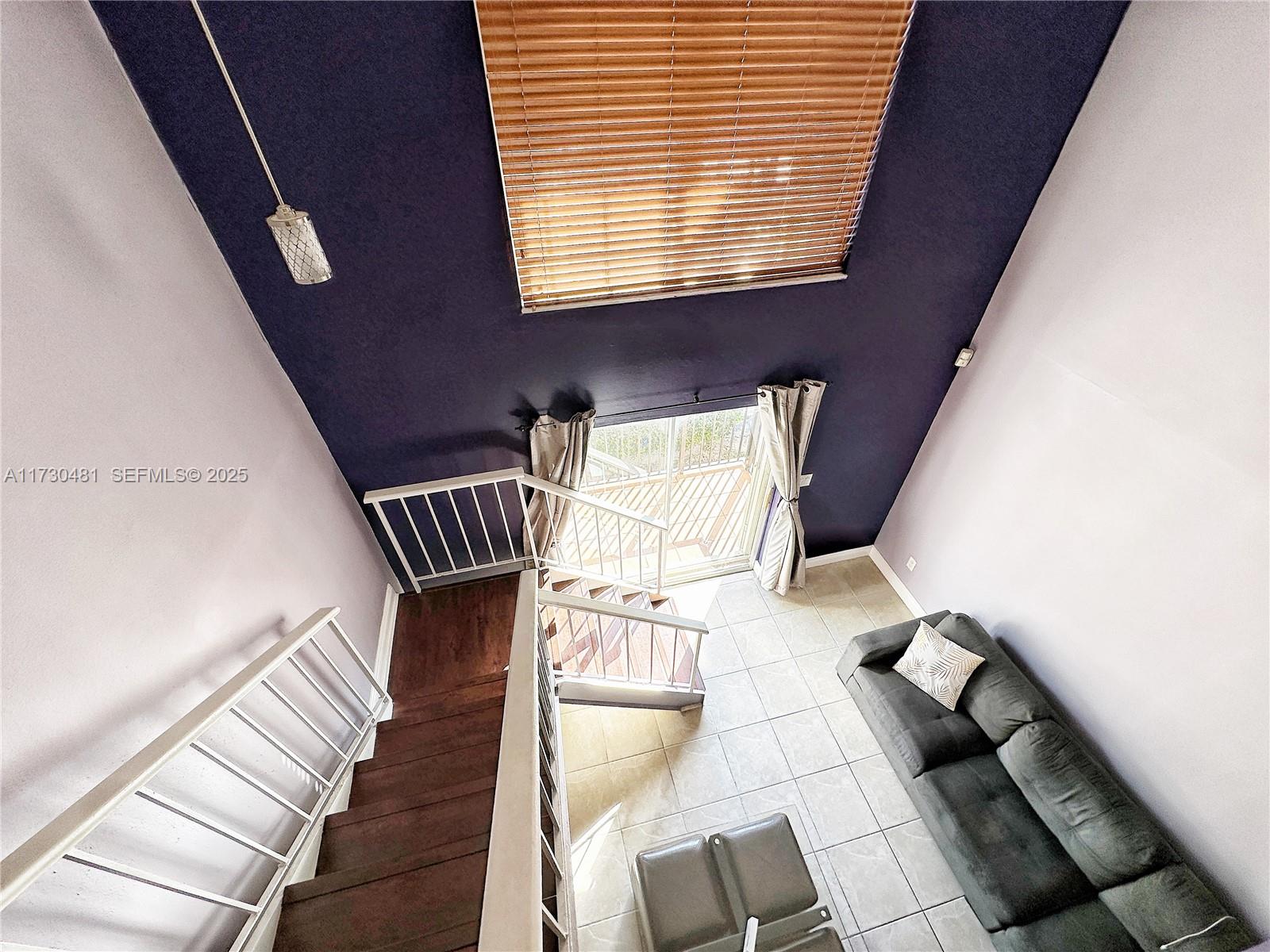 8550 Southwest 109th Avenue, Unit 5217 Miami, FL 33173 - Photo 6 of 16 a view of entryway and hall with wooden floor