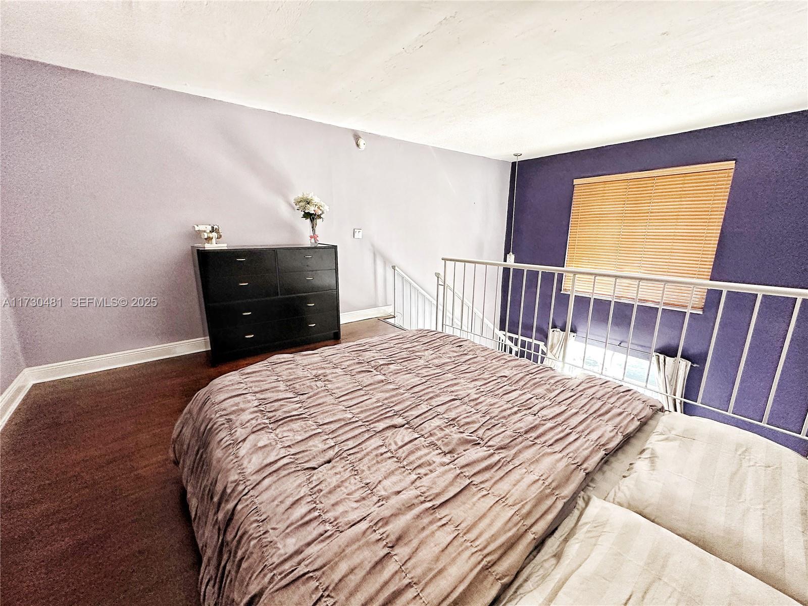 8550 Southwest 109th Avenue, Unit 5217 Miami, FL 33173 - Photo 7 of 16 a bedroom with a bed and a window