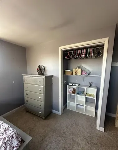 a bathroom with a double vanity sink toilet and shower