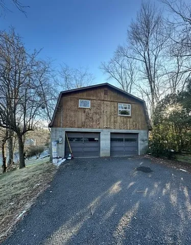 a view of house with outdoor space and bathroom
