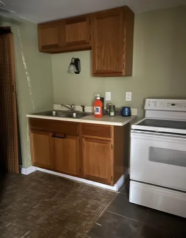 a white toilet sitting next to a bathroom sink