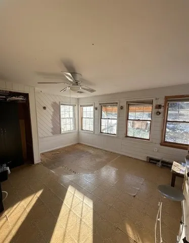 a view of an empty room and a windows