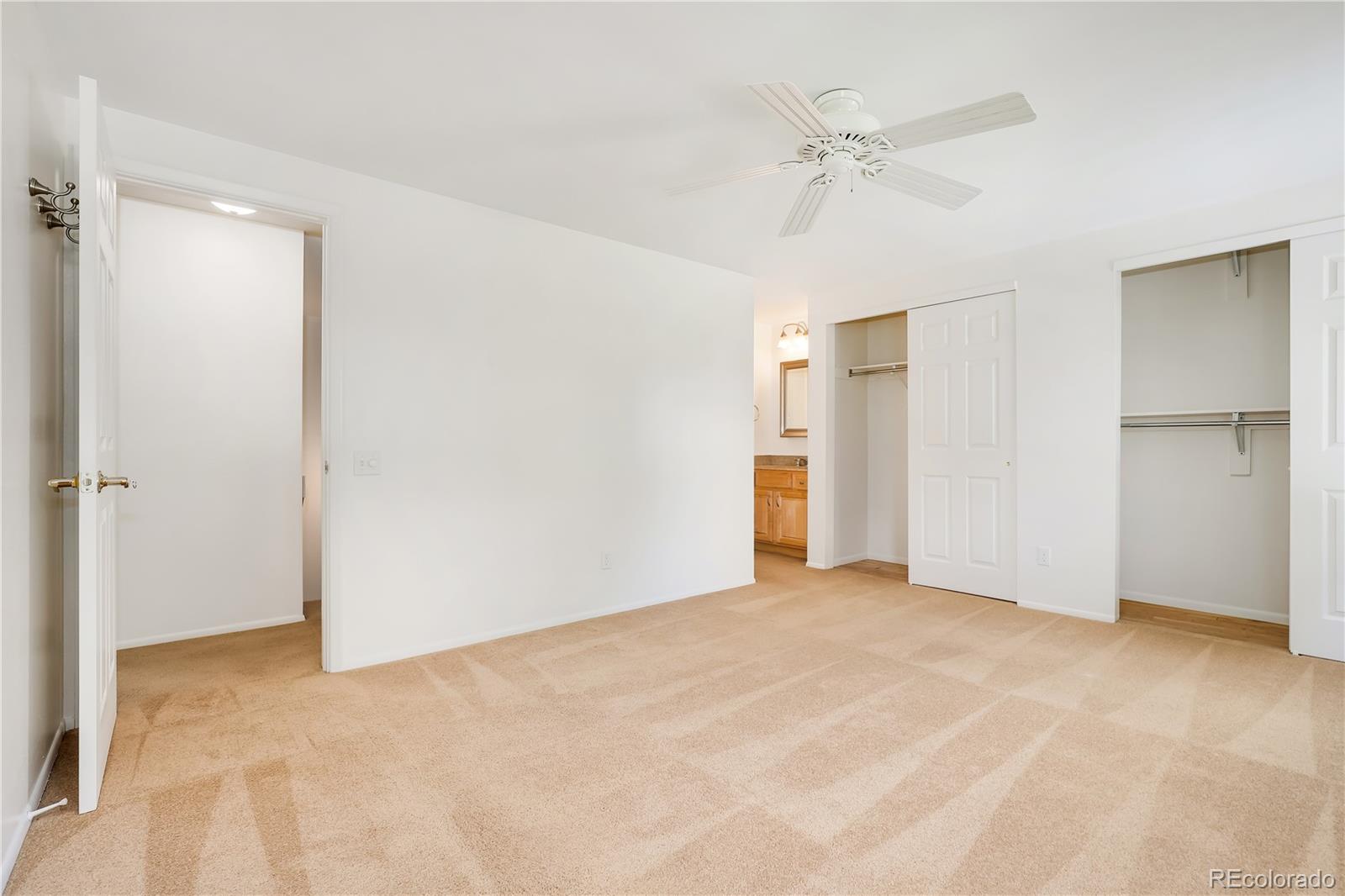 8760 Independence Way Arvada, CO 80005 - Photo 29 of 40 a view of a livingroom with a ceiling fan & entryway