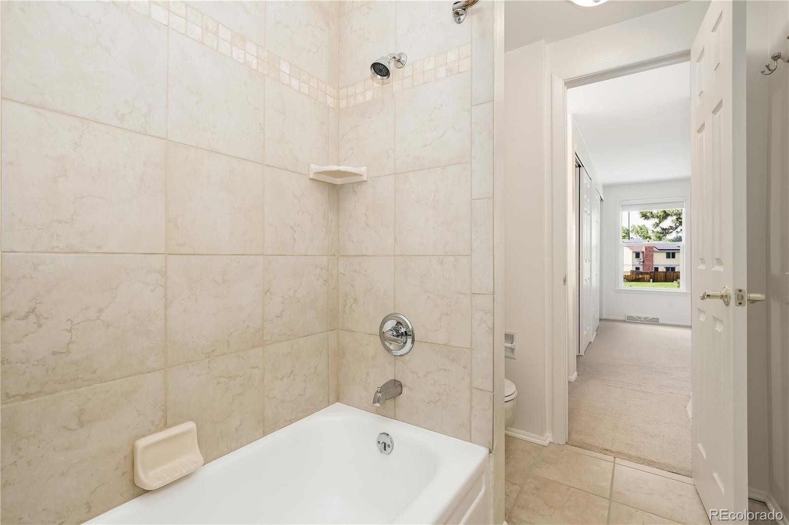 8760 Independence Way Arvada, CO 80005 - Photo 33 of 40 a bathroom with a bathtub