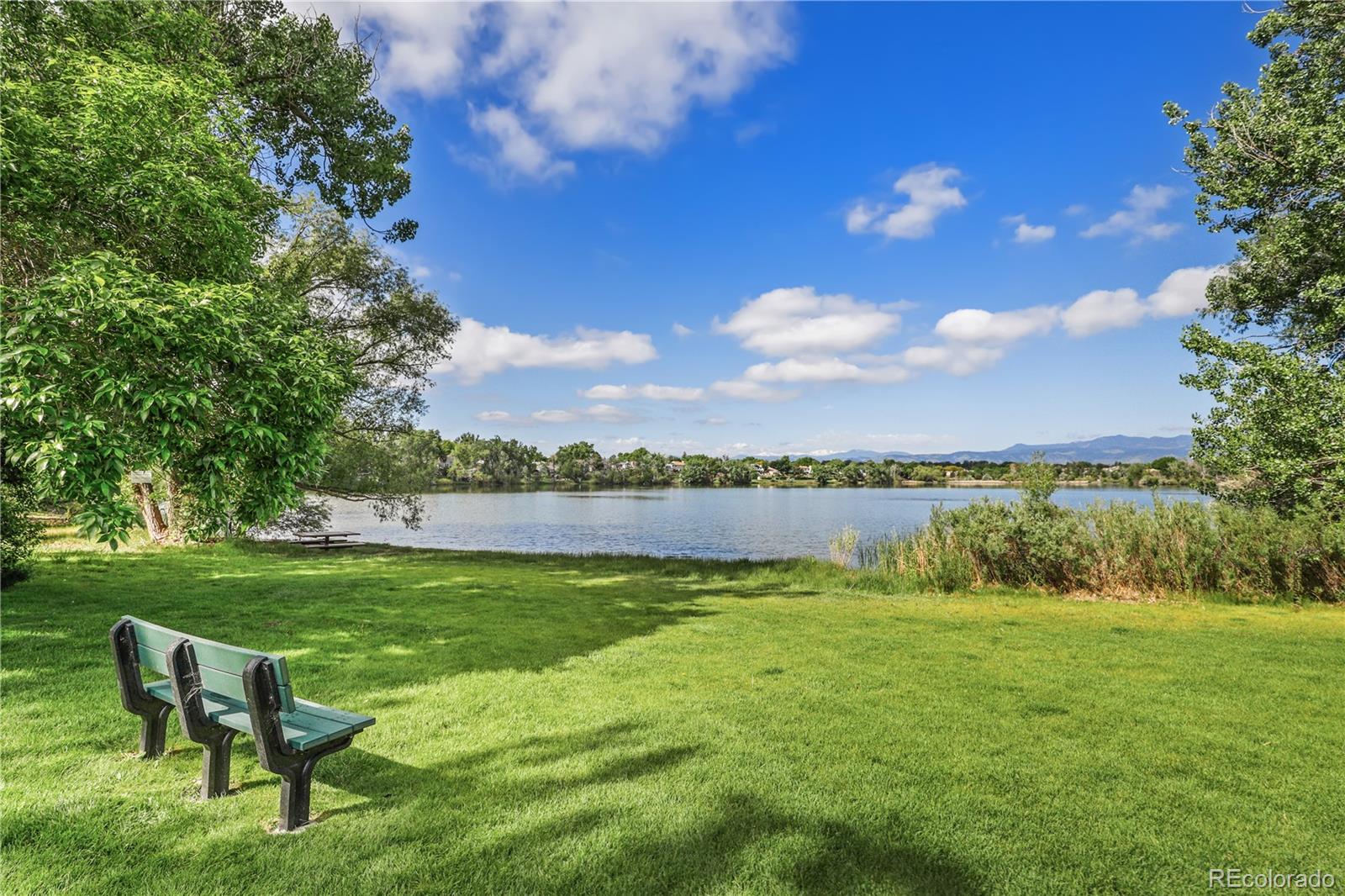 8760 Independence Way Arvada, CO 80005 - Photo 36 of 40 a view of a lake with a yard