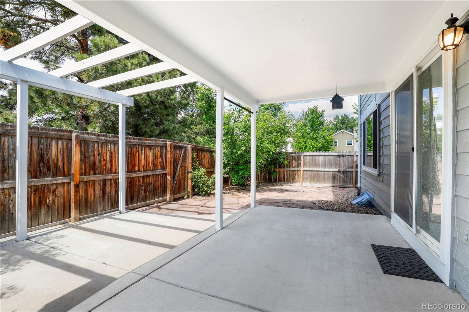 8760 Independence Way Arvada, CO 80005 - Photo 7 of 40 a view of outdoor space with porch
