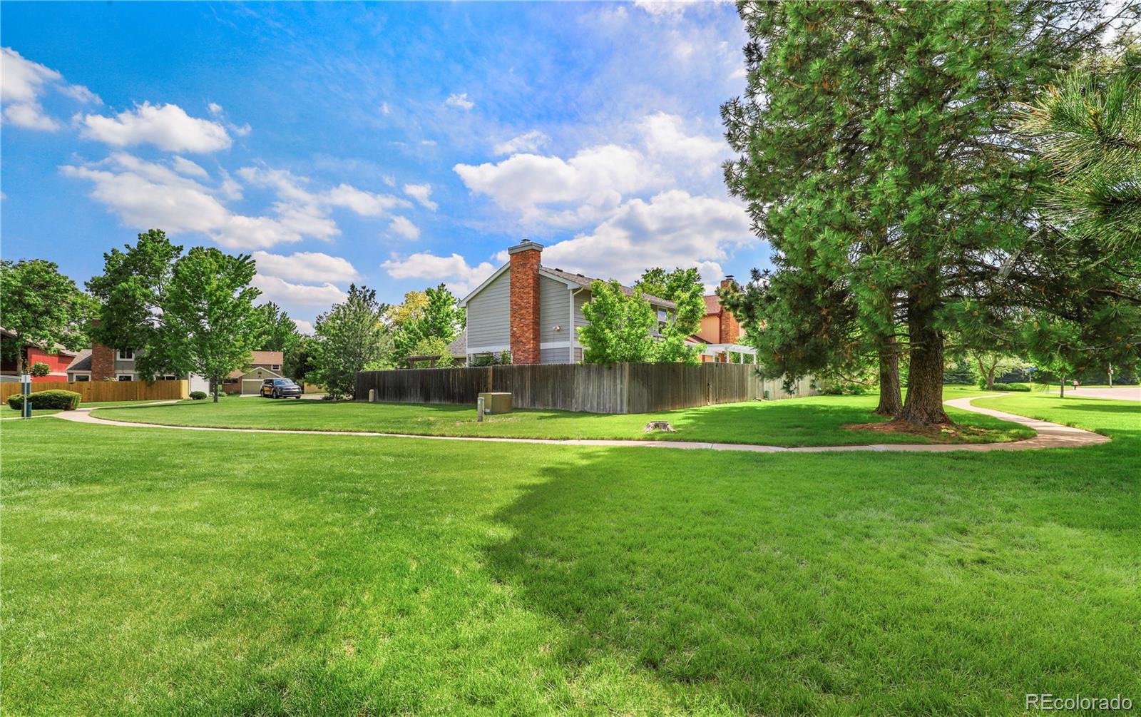 8760 Independence Way Arvada, CO 80005 - Photo 8 of 40 a view of a park with large trees