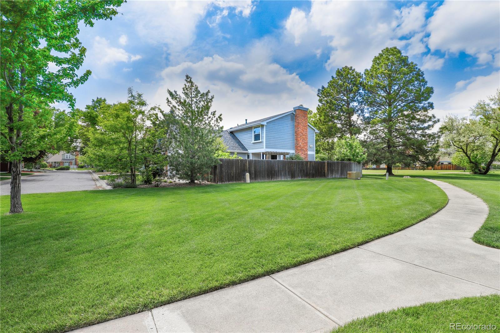 8760 Independence Way Arvada, CO 80005 - Photo 9 of 40 a view of a yard with a fountain