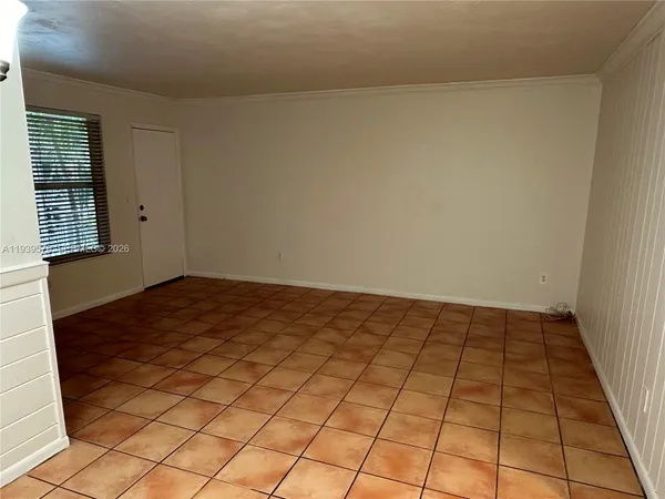 a view of an empty room and window
