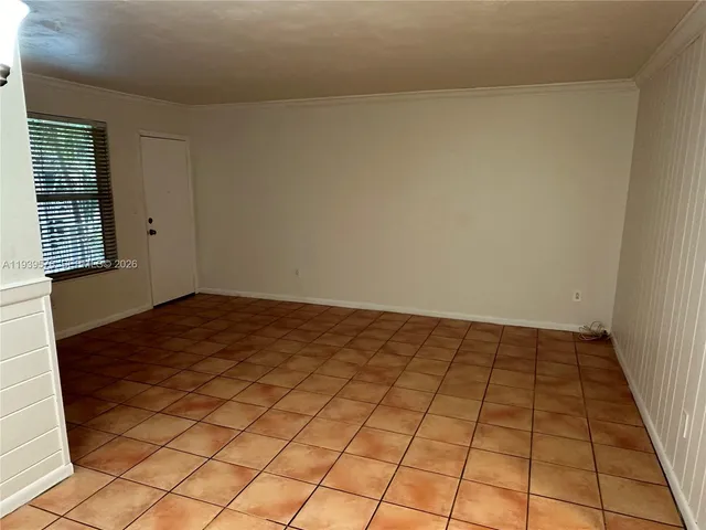 a view of an empty room and window