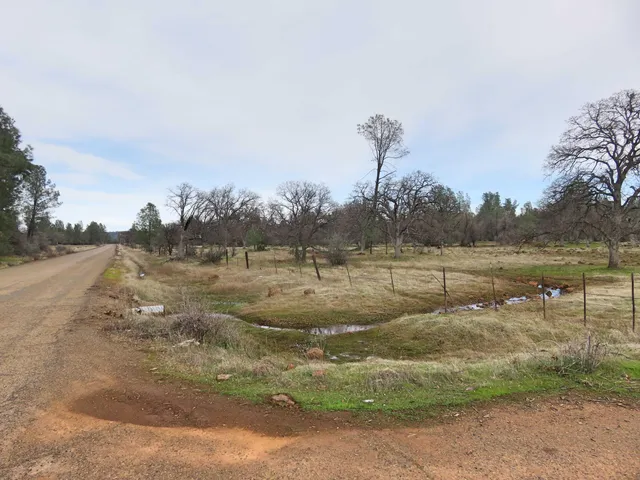 a view of a town with mountains in the background
