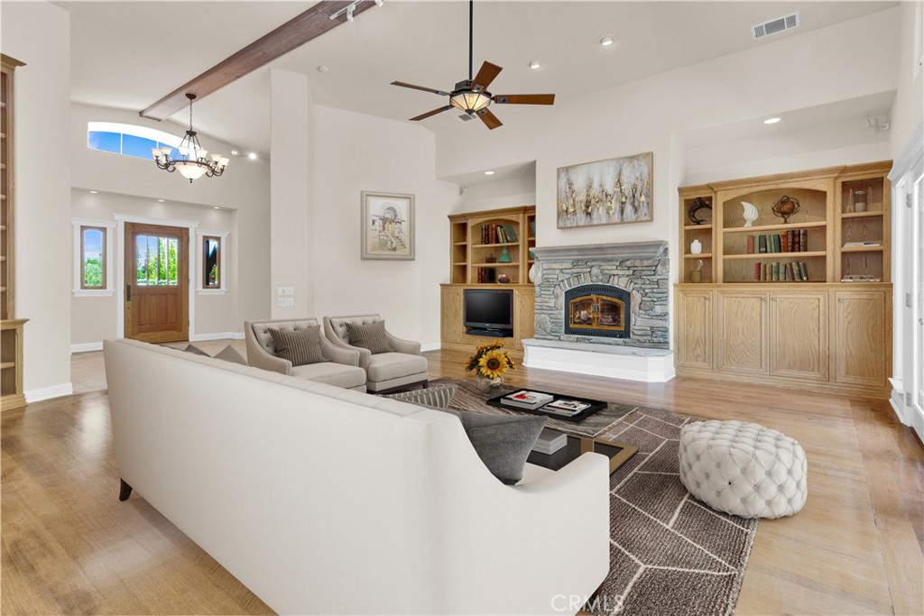 117 Frontier Way Templeton, CA 93465 - Photo 16 of 60 a living room with furniture a fireplace and a chandelier