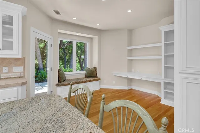 a bedroom with a bed and cabinets